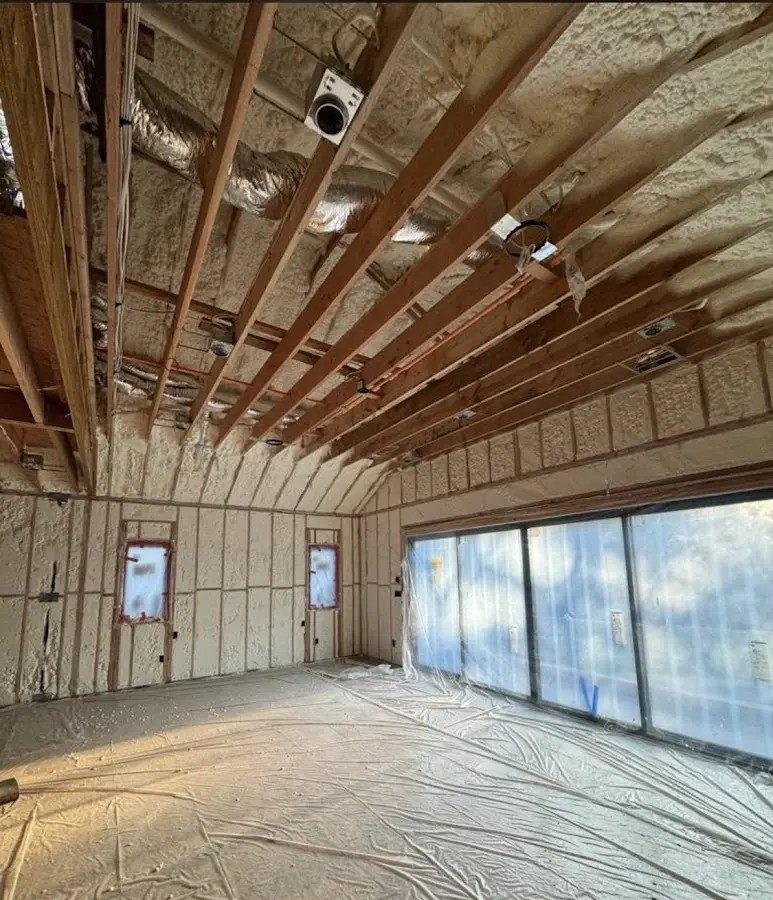Interior walls and ceiling insulated with spray foam during new construction in Ypsilanti